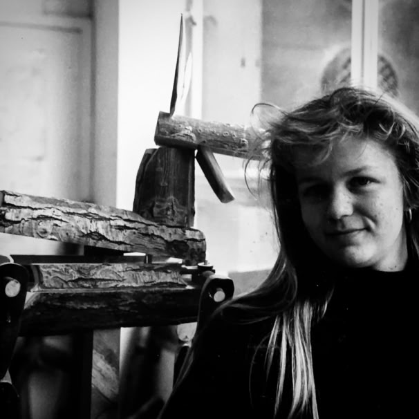 early workshop photo at Manchester with a wooden automata in the back ground.